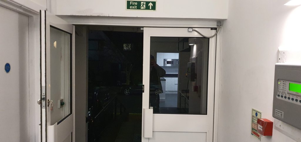 Communal uPVC entrance door fitted with an electric locking system