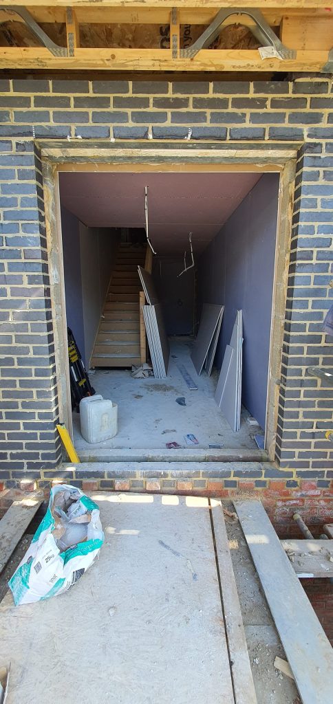 Entrance area during construction and building systems installation